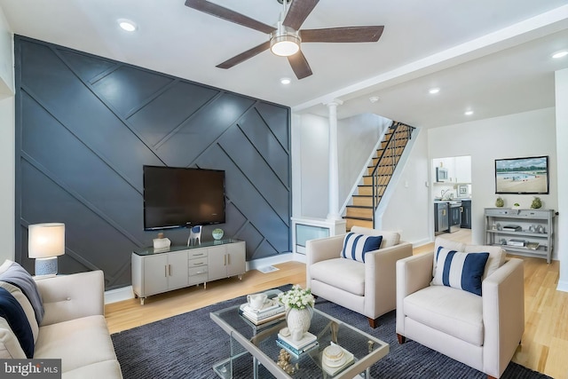 2533 N Opal St, Philadelphia, PA 19132 - living area featuring a decorative wall, wood finished floors, a ceiling fan, decorative columns, and recessed lighting
