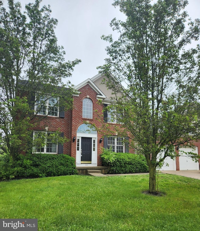 443 W Country Club Dr, Westampton, NJ 08060 - view of front facade featuring brick siding, a front yard, and concrete driveway