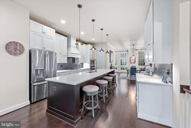 20383 Codman Dr, Ashburn, VA 20147 - kitchen with stainless steel refrigerator with ice dispenser, a sink, custom exhaust hood, a kitchen island with sink, and white cabinetry