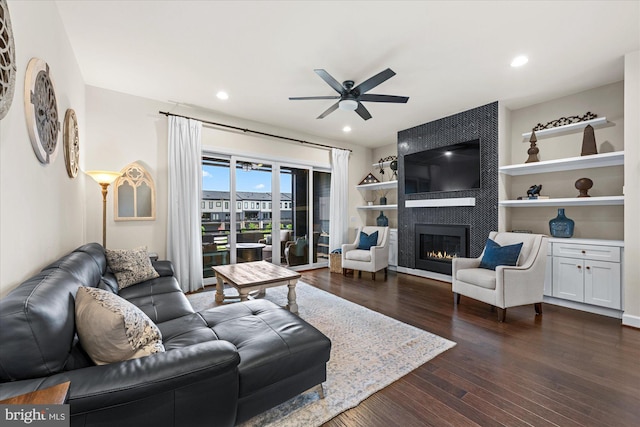 20383 Codman Dr, Ashburn, VA 20147 - living area with ceiling fan, dark wood-style floors, a large fireplace, and recessed lighting