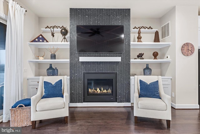 20383 Codman Dr, Ashburn, VA 20147 - living area with wood finished floors, a fireplace, and baseboards
