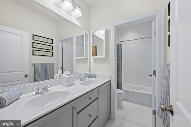 20383 Codman Dr, Ashburn, VA 20147 - full bathroom with double vanity, toilet, shower / bath combo with shower curtain, and tile patterned flooring