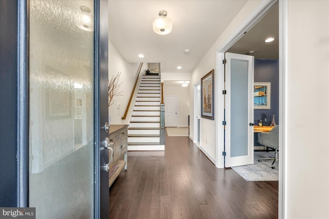 20383 Codman Dr, Ashburn, VA 20147 - foyer entrance featuring dark wood-style flooring, stairway, recessed lighting, and baseboards