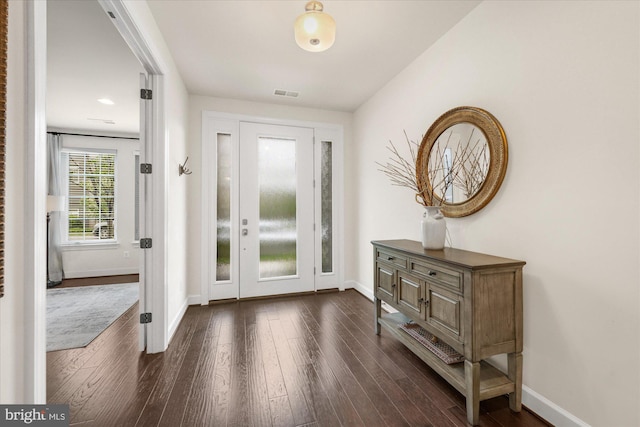 20383 Codman Dr, Ashburn, VA 20147 - foyer entrance with dark wood-style flooring and baseboards