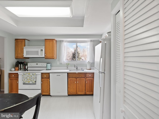 2 Darnell Ct, Olney, MD 20832 - kitchen with white appliances, a sink, light countertops, brown cabinetry, and light flooring