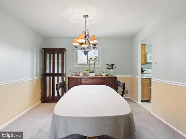 2 Darnell Ct, Olney, MD 20832 - dining area featuring a chandelier, light carpet, and baseboards