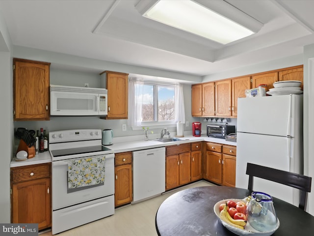 2 Darnell Ct, Olney, MD 20832 - kitchen featuring white appliances, a sink, light countertops, and brown cabinetry