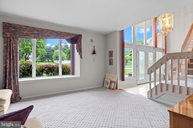 11 Candace Ct, Richboro, PA 18954 - living area featuring plenty of natural light, stairs, a chandelier, and carpet flooring