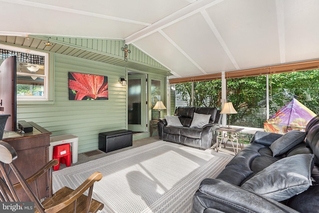 sunroom with an outdoor living space, vaulted ceiling, and outdoor dining area