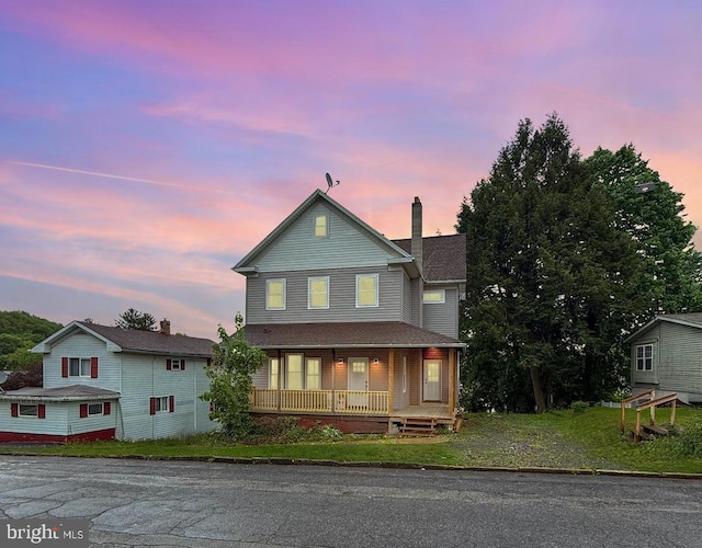407 Lingle St, Osceola Mills, PA 16666 - view of front of home featuring covered porch and a chimney