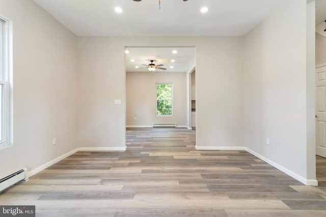 407 Lingle St, Osceola Mills, PA 16666 - spare room with a ceiling fan, a baseboard radiator, recessed lighting, and wood finished floors