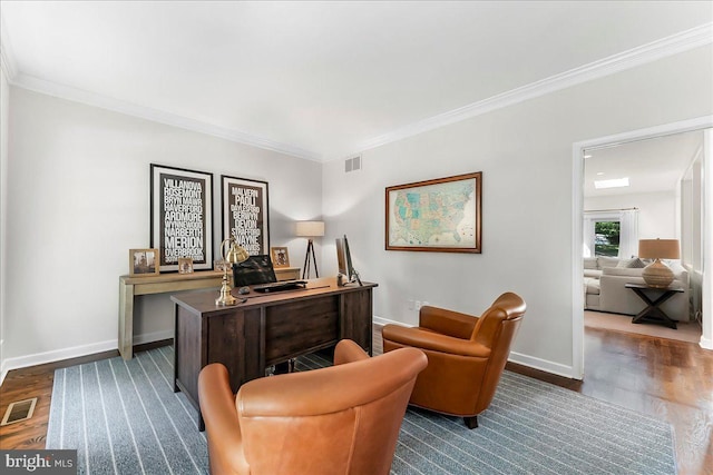 office with dark wood finished floors, crown molding, and baseboards
