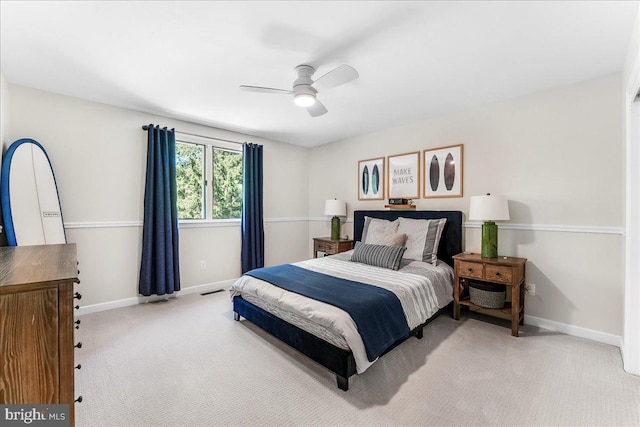 bedroom featuring carpet floors, baseboards, and a ceiling fan