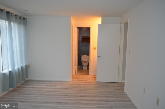 18050 Chalet Dr Unit 14-303, Germantown, MD 20874 - spare room with light wood-type flooring and baseboards