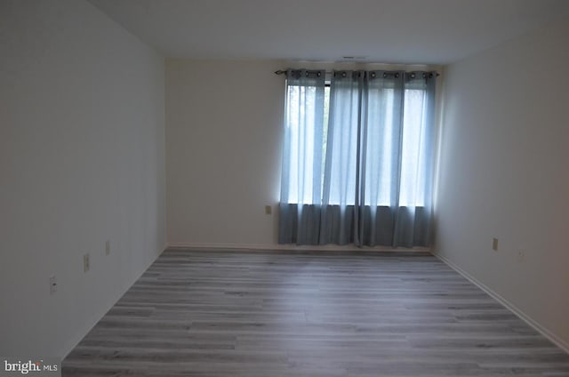 18050 Chalet Dr Unit 14-303, Germantown, MD 20874 - unfurnished room with plenty of natural light and wood finished floors