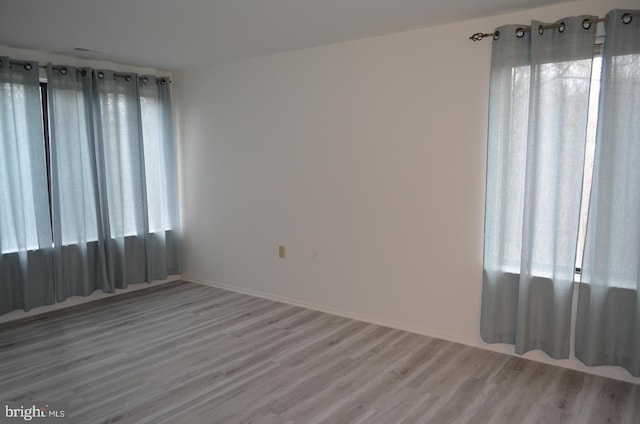 18050 Chalet Dr Unit 14-303, Germantown, MD 20874 - spare room with wood finished floors and baseboards