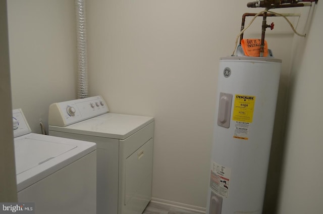 18050 Chalet Dr Unit 14-303, Germantown, MD 20874 - laundry area featuring water heater and washing machine and dryer