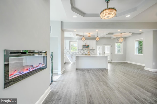 4106 Fleetwood Ave, Baltimore, MD 21206 - living area with a tray ceiling, light wood-type flooring, baseboards, plenty of natural light, and recessed lighting
