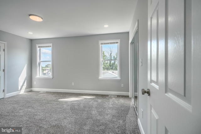 4106 Fleetwood Ave, Baltimore, MD 21206 - unfurnished bedroom featuring multiple windows, baseboards, and carpet