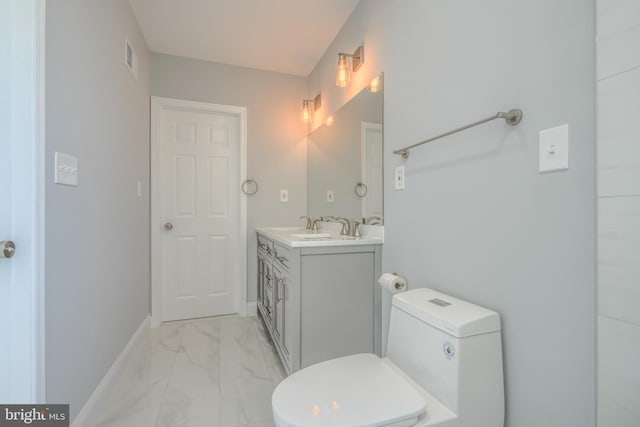4106 Fleetwood Ave, Baltimore, MD 21206 - bathroom with vanity, marble finish floors, toilet, and baseboards