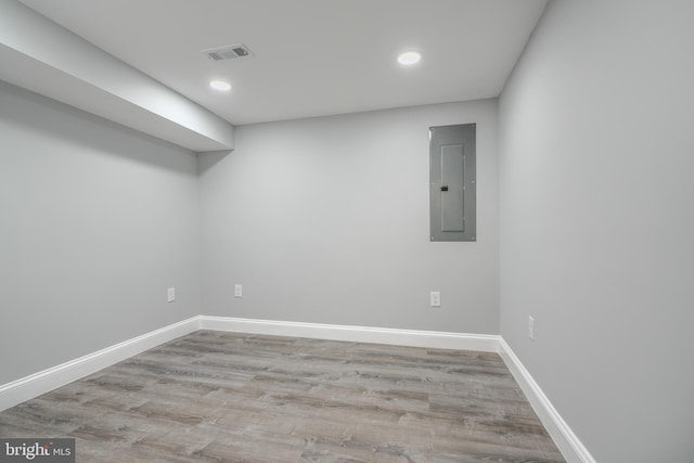 4106 Fleetwood Ave, Baltimore, MD 21206 - spare room with electric panel, baseboards, wood finished floors, and recessed lighting