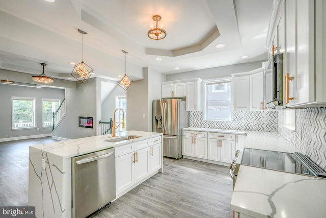 4106 Fleetwood Ave, Baltimore, MD 21206 - kitchen with stainless steel appliances, a sink, tasteful backsplash, recessed lighting, and white cabinetry