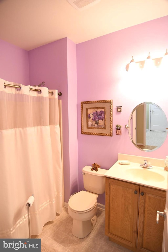 full bath with vanity, toilet, tile patterned floors, and baseboards