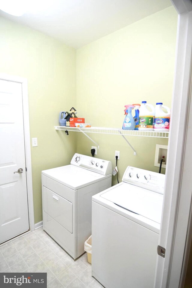 laundry room with washer and dryer