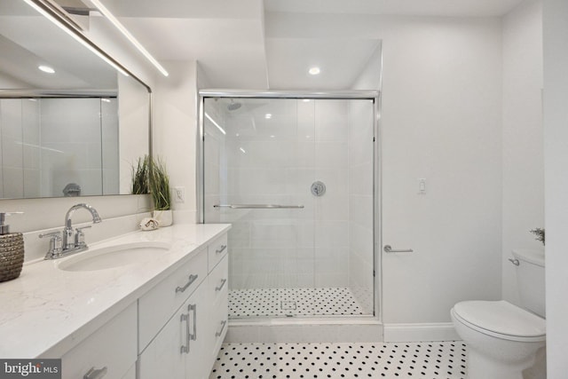 full bath with recessed lighting, a shower stall, toilet, vanity, and baseboards