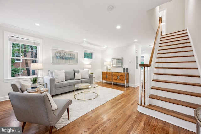 living room with ornamental molding, baseboards, stairway, recessed lighting, and wood finished floors