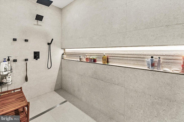 full bath featuring tiled shower
