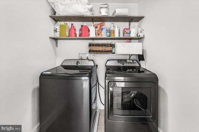 clothes washing area featuring independent washer and dryer