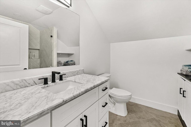 bathroom featuring vanity, walk in shower, vaulted ceiling, toilet, and tile patterned flooring