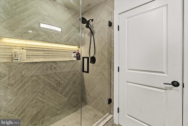 bathroom with a stall shower