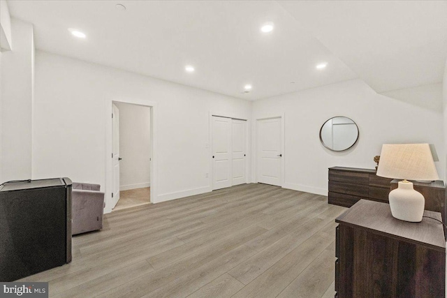 sitting room featuring light wood-type flooring, baseboards, and recessed lighting