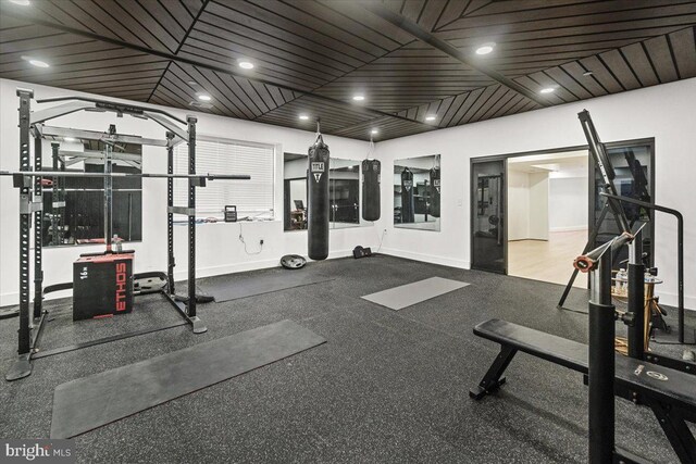 workout area featuring baseboards and recessed lighting