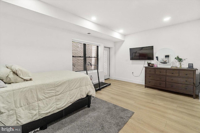 bedroom with light wood-style flooring, recessed lighting, and baseboards