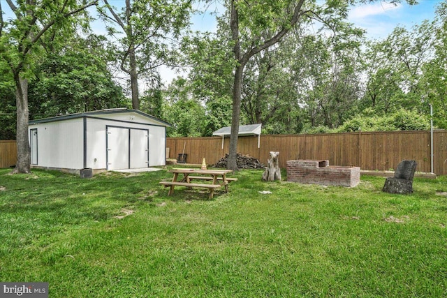 view of yard with a storage unit and an outbuilding