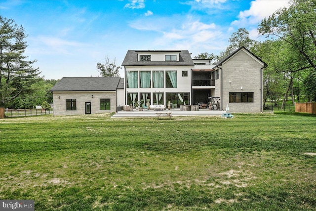 back of house featuring a wooden deck