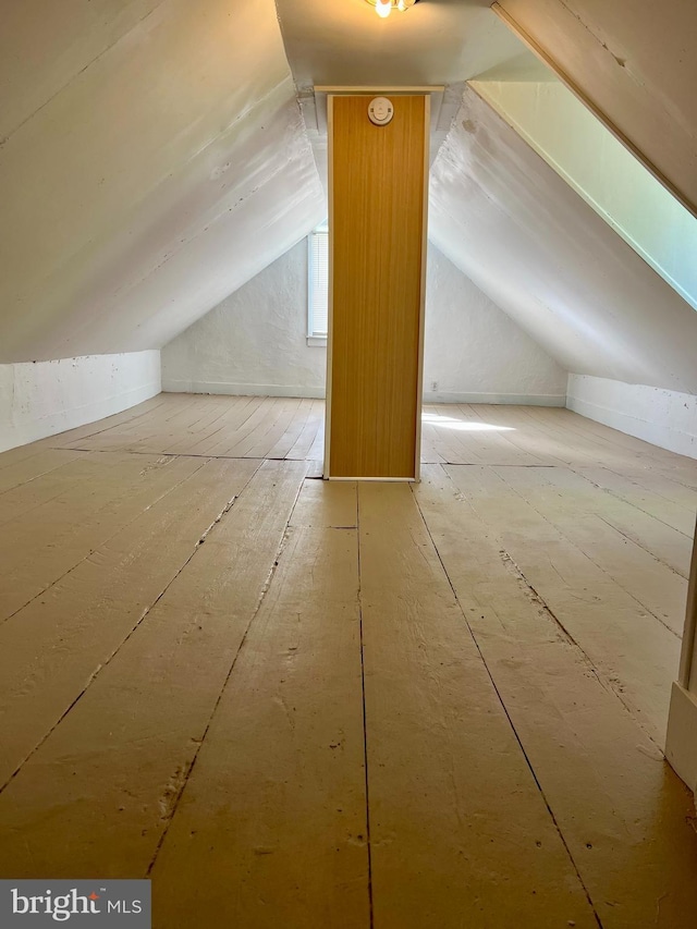 additional living space with vaulted ceiling