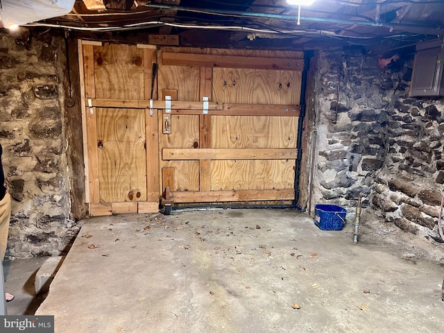 unfinished basement with electric panel