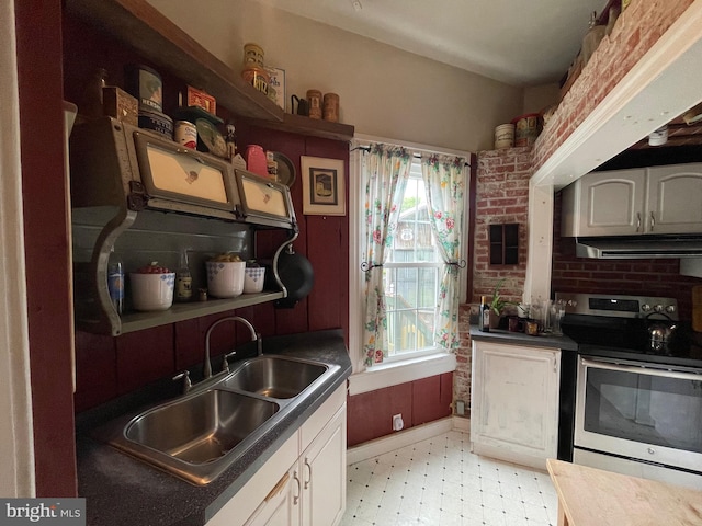 120 Hanover St, Pemberton, NJ 08068 - kitchen featuring electric range, a sink, ventilation hood, light flooring, and dark countertops