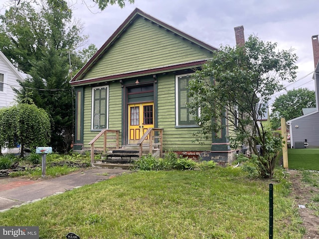 120 Hanover St, Pemberton, NJ 08068 - view of front of property featuring a front lawn and a chimney
