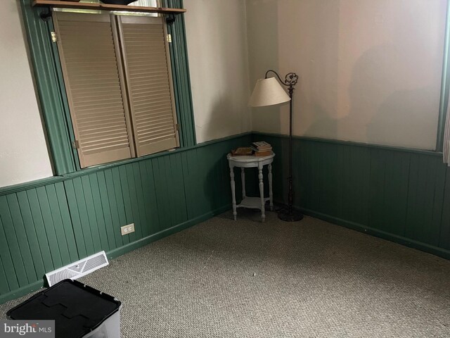 120 Hanover St, Pemberton, NJ 08068 - unfurnished room featuring wainscoting, carpet flooring, and wooden walls