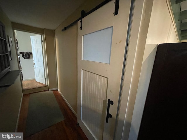 120 Hanover St, Pemberton, NJ 08068 - hall featuring wood finished floors, a barn door, and baseboards