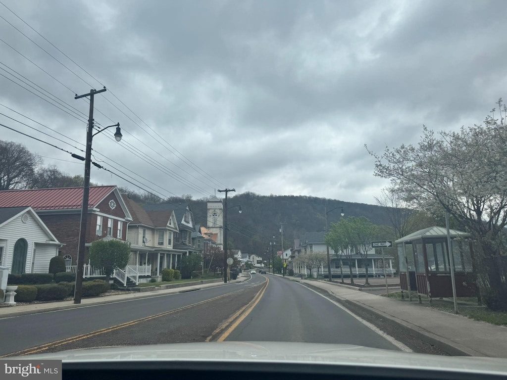 311 Johnson St, Westernport, MD 21562 - view of asphalt road with street lighting, sidewalks, and curbs