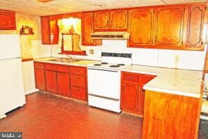 649 Hilltop Rd, Myerstown, PA 17067 - kitchen with white appliances, exhaust hood, light countertops, and brown cabinetry