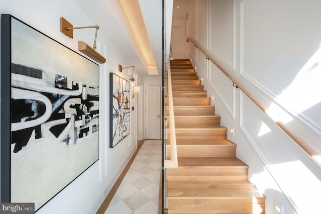 1827 S St NW Unit 1, Washington, DC 20009 - staircase with a decorative wall and tile patterned floors
