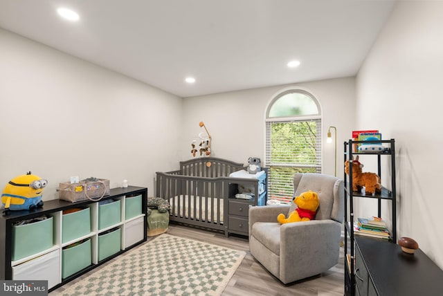 7 Canterbury Sq Unit 401, Alexandria, VA 22304 - bedroom with wood finished floors, a crib, and recessed lighting