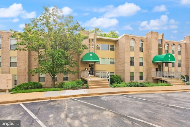 7 Canterbury Sq Unit 401, Alexandria, VA 22304 - view of building exterior featuring uncovered parking
